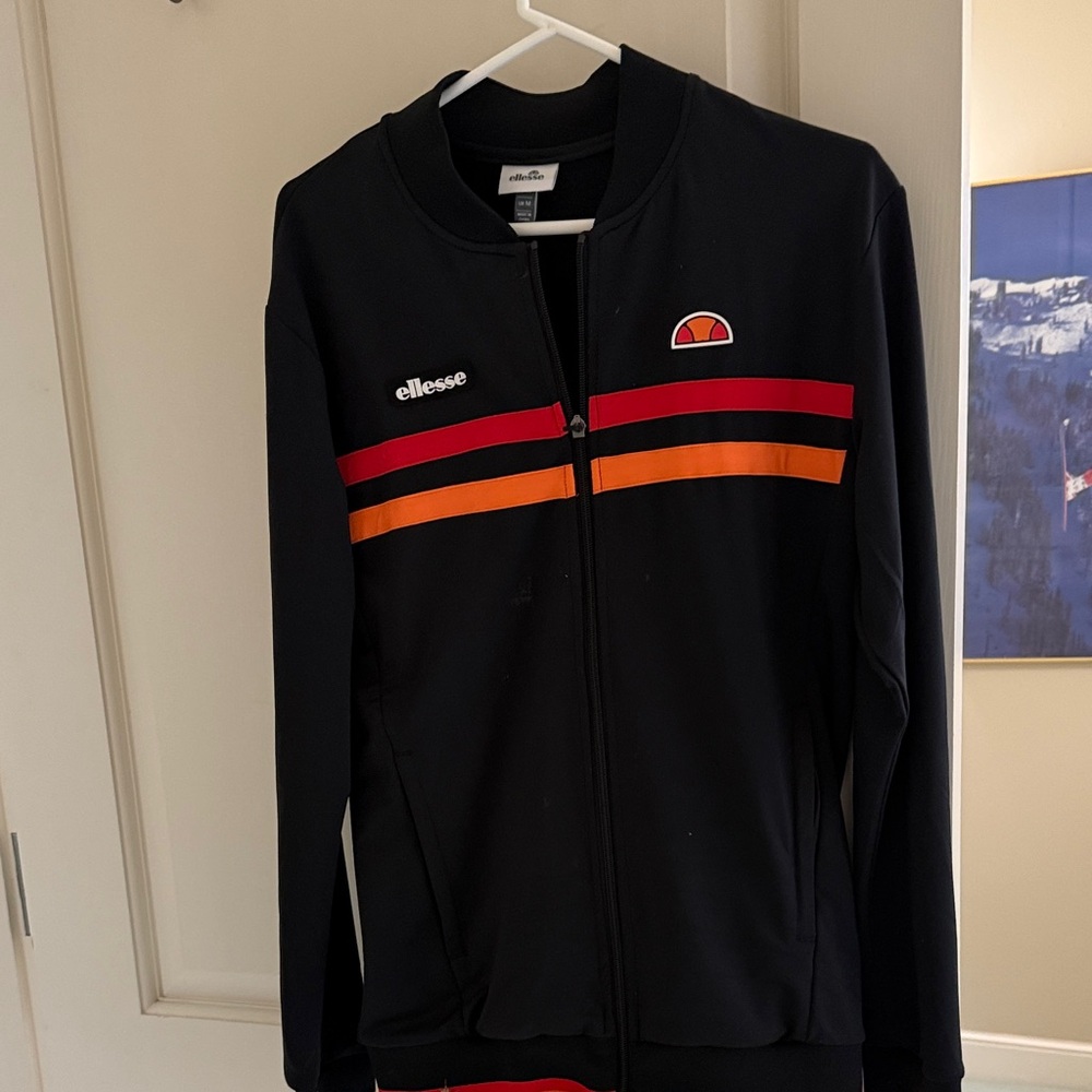 Ellesse Black Jacket with Vibrant Stripes